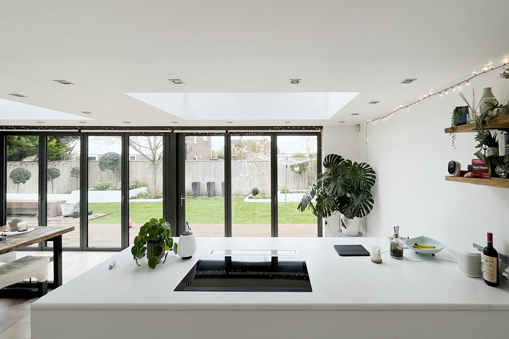 Beautifully designed room with a skylight showcasing Alight Lantern Blinds' custom-fitted blinds for optimal light control and style